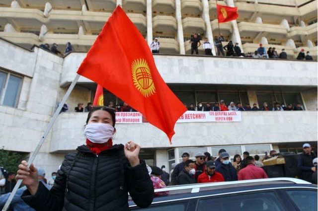 People attend a rally in front of Kyrgyzstan's interior ministry in Bishkek