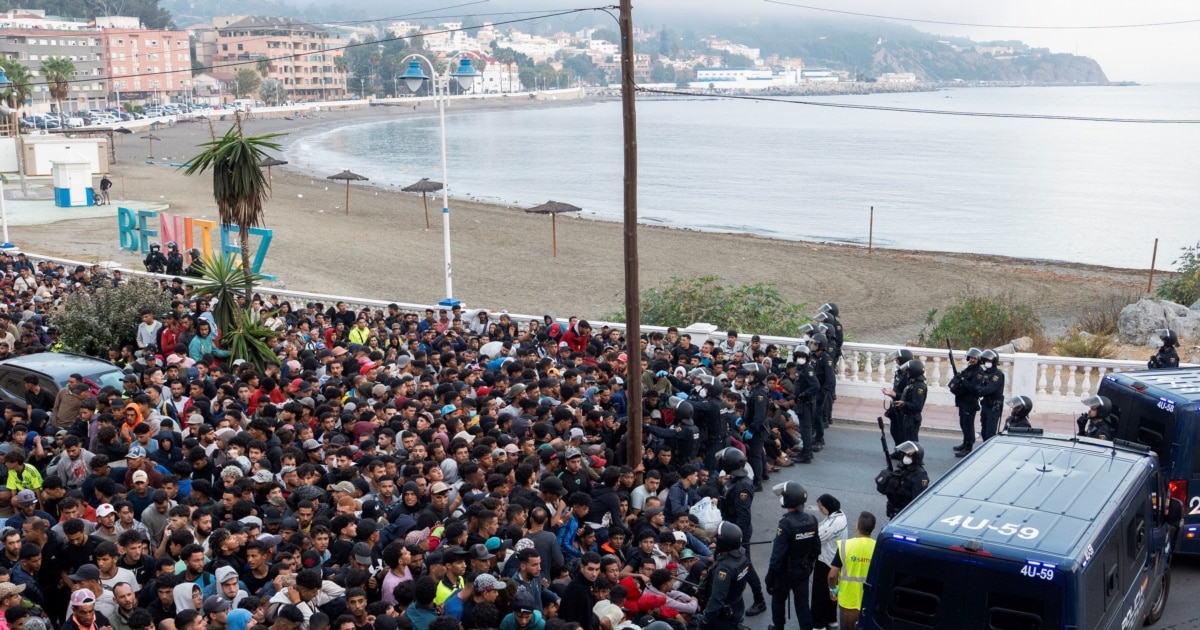 Spanish police relocate hundreds of migrants from Ceuta beaches into new port tent camp amid clashes